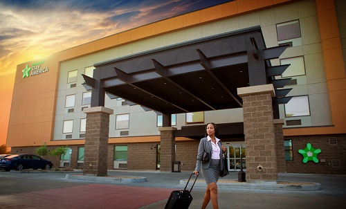 business woman outside extended stay america hotel