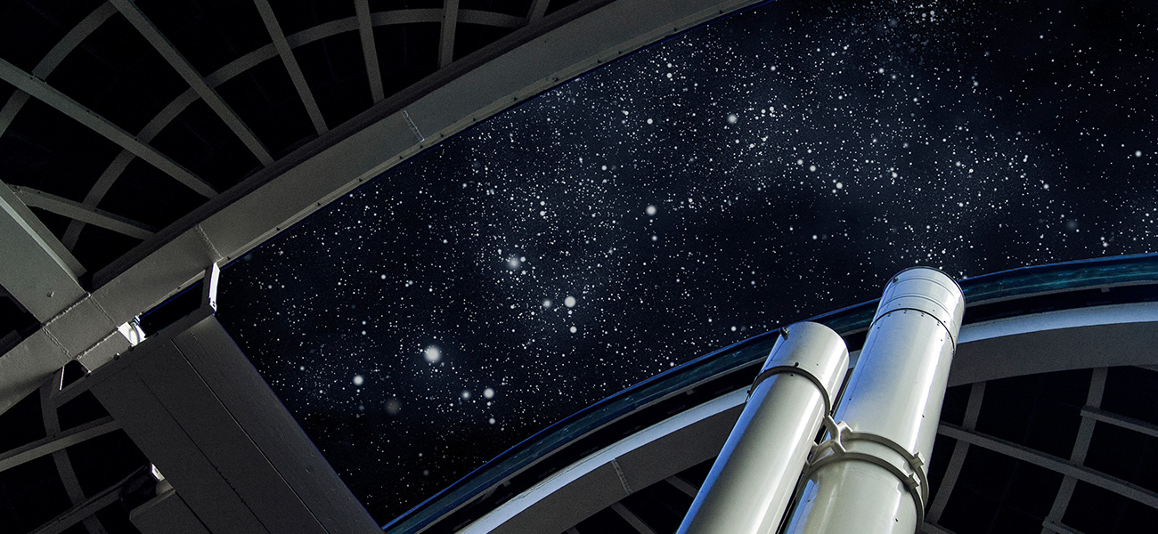 Telescope and starry sky view at the Griffith Observatory.