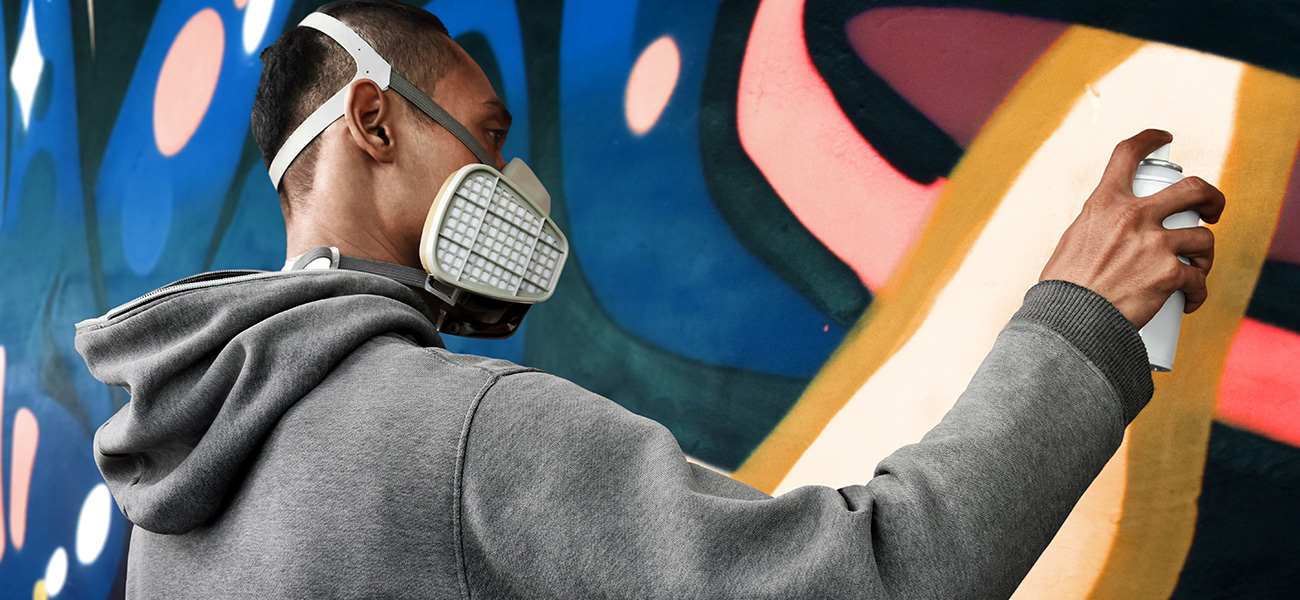 Mural artist painting.
