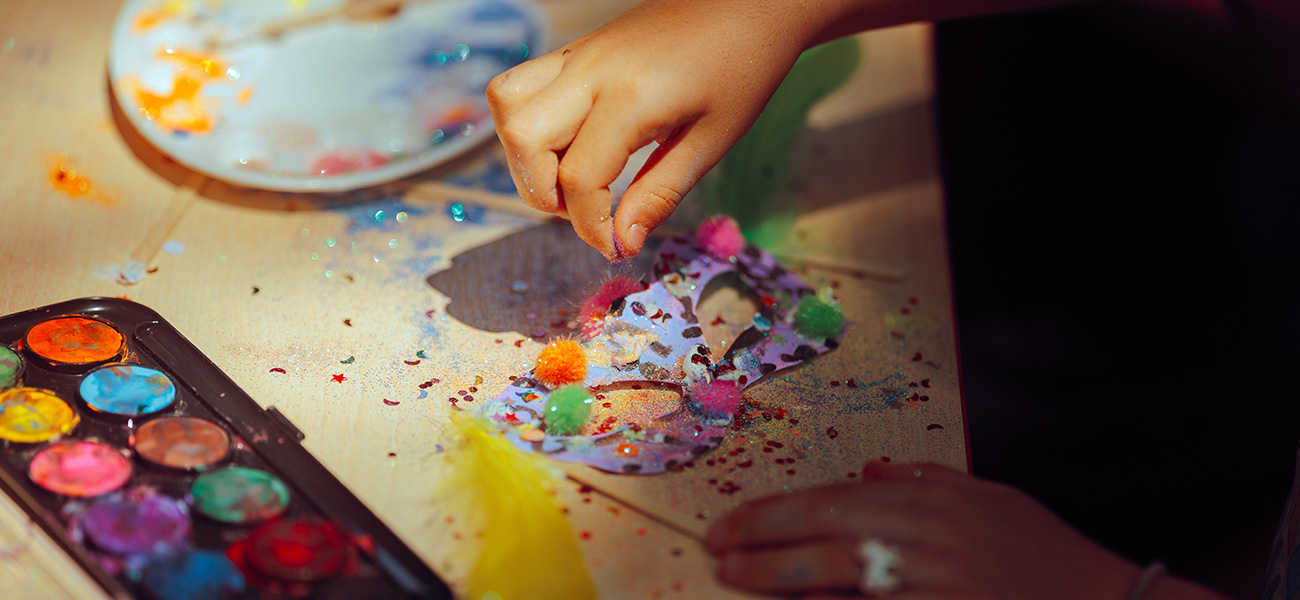 Kid doing arts and crafts.
